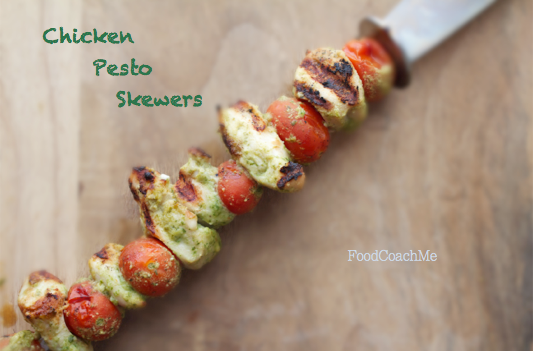 chicken pesto skewers with chicken breast, tomato and pesto on a grill skewer 