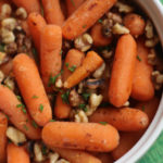 WLS Friendly Side Dish for the holidays! These easy to make baby carrots have the holiday flavors of toasted walnuts and fresh chive. They not only look pretty, taste awesome but keep you on track with your goals! Pair with holiday turkey and ham and you're all set! #gastricsleeveholidays #wlsholidaydishes #gastricbypassholidays #bariatricholidays
