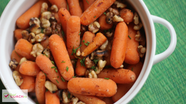WLS Friendly Side Dish for the holidays! These easy to make baby carrots have the holiday flavors of toasted walnuts and fresh chive. They not only look pretty, taste awesome but keep you on track with your goals! Pair with holiday turkey and ham and you're all set! #gastricsleeveholidays #wlsholidaydishes #gastricbypassholidays #bariatricholidays