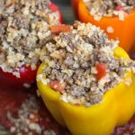 Stuffed peppers with lean ground beef and cauliflower rice with salsa tomatoes taco seasoning and cumin