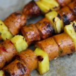 Pre-cooked chicken sausage with fresh pineapple chunks threaded on skewers and grilled for low carb bariatric surgery recipe