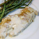 photo of chicken with bariatric alfredo sauce on top with grilled asparagus